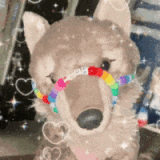 gif of a canid plush wagging its tail